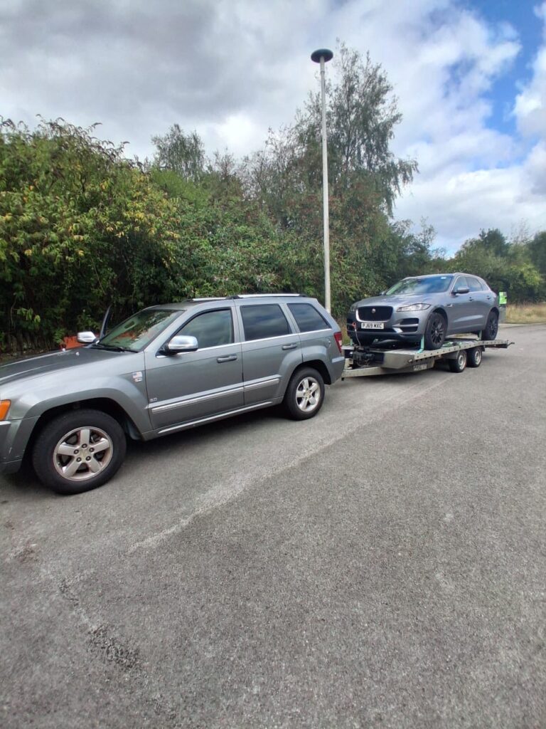 Automove Transportation | Home page featuring car being towed